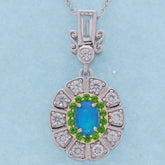 Oval blue opal sterling silver pendant with accent gemstones, elegant jewelry for a sophisticated collection.